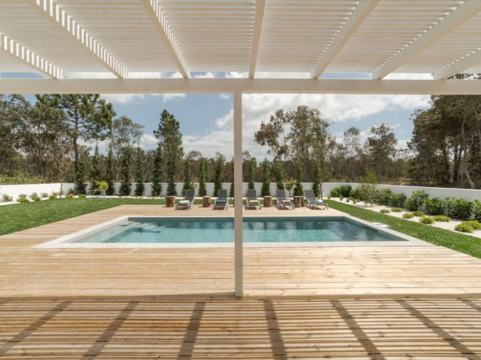 Backyard pool with pergola